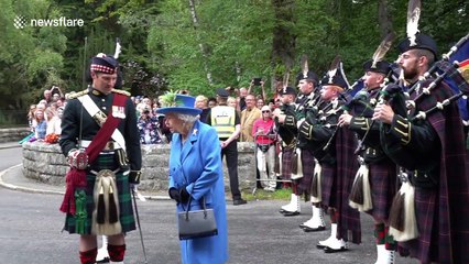 Highlanders march through manure greeting Queen at Balmoral