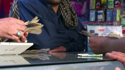 Afghans return home in record numbers as Iran currency plunges