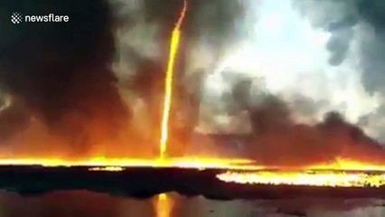 Amazing footage shows firenado spinning into air during blaze at UK plastic pallet factory