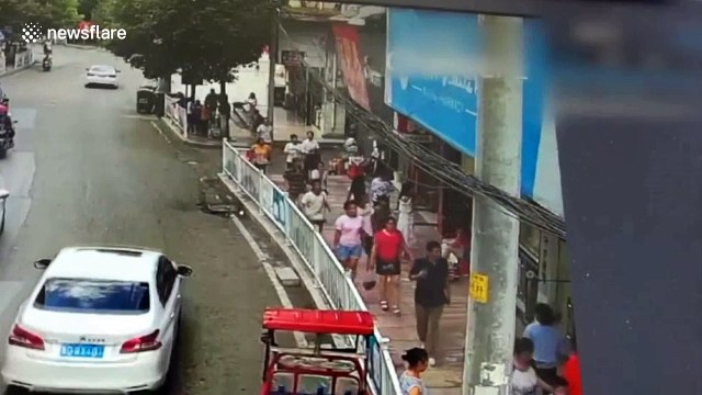 Shocking moment billboard collapses on passersby, injuring five