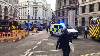 Fire and police vehicles assemble at Bank station during fire alert