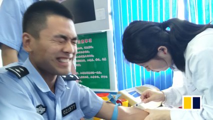 Chinese policeman’s reaction to drawing blood goes viral