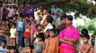 Moment father balances daughter on bamboo pole in front of clapping audience