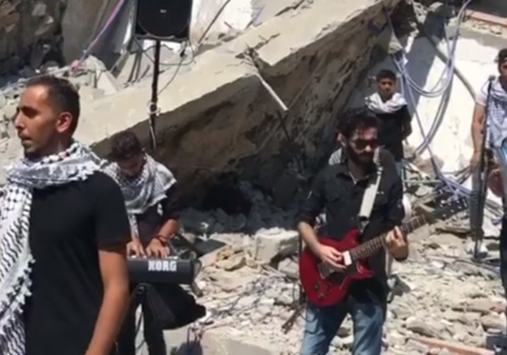 Palestinian Musicians Perform in the Rubble of Building Destroyed by Israeli Strikes