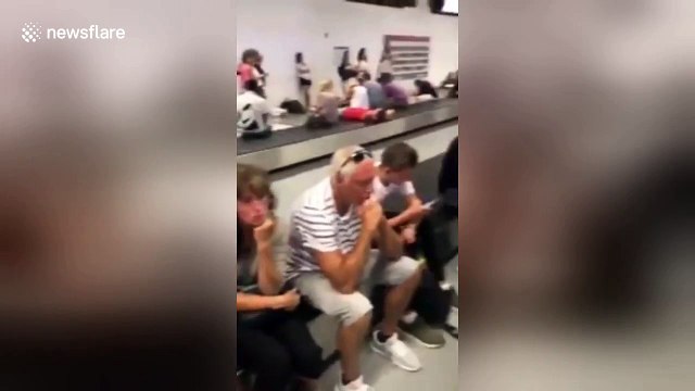 Exhausted passengers lay on conveyor belts amid 'biggest ever' Ryanair strike