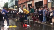 British summer strikes again! Londoners make chair bridge to avoid puddle