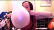 Blowing giant bubble gum bubbles with a whole roll of bubble tape!