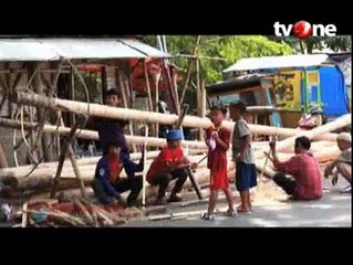 Sejarah Kelam Permainan Panjat Pinang