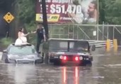 Police Escort Bride and Groom Across Flood Waters in New Jersey