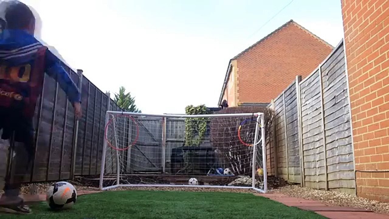 5 year old practices his free kick skills