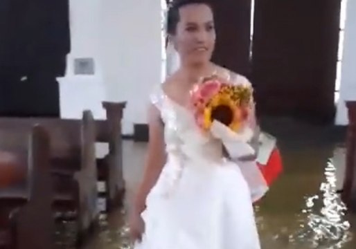 Bride Wades Through Flooded Church Aisle in Aftermath of Monsoon