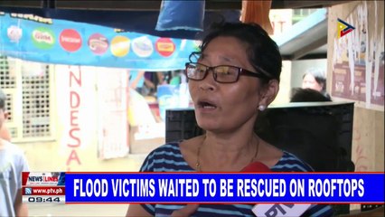 NEWS: Flood victims waited to be rescued on rooftops