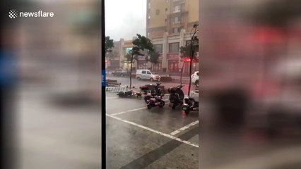 Woman blown down flight of overpass steps during powerful windstorm