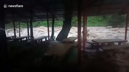 Dramatic moment flash flood engulfs cafe in Thailand