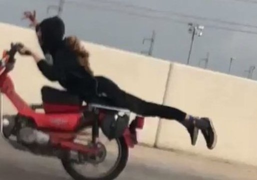 Daredevil Motorcyclist Performs Stunt on San Antonio Highway