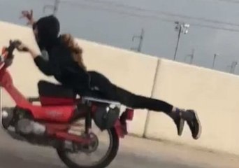 Daredevil Motorcyclist Performs Stunt on San Antonio Highway
