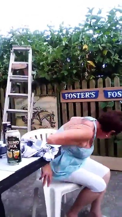 Lad falls off ladder and over a fence