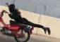Daredevil Motorcyclist Performs Stunt on San Antonio Highway