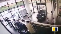 Chinese woman plunges BMW into car dealership while taking a test drive