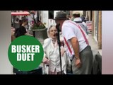 Pensioner performs duet of 'Wonderful World' with busker