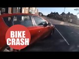 Cyclist nearly collides with a car after a reckless driver sharply pulls out