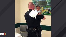 Heartwarming Images Show NYPD Officers Comforting Child Involved In Car Crash