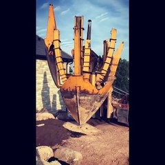 First of seven large spaded conifers going in on the berm