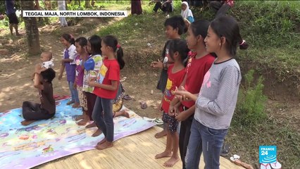 Indonesia earthquake: aid workers help children to cope in aftermath of disaster