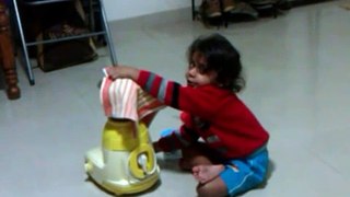 My son operating Mixer grinder without electricity.