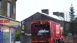 Dustbin lorry stuck in the snow