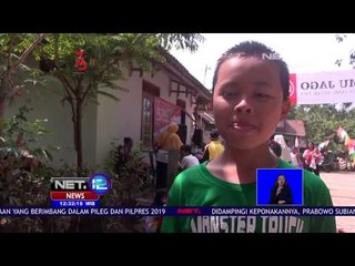 Download Video: Lomba Tangkap Ikan untuk Anak anak Diselenggarakan untuk Menyambut Hari Kemerdekaan RI - NET 12