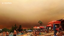 Looks like a holiday of horror! Tourists shocked by huge cloud of smoke filling the sky
