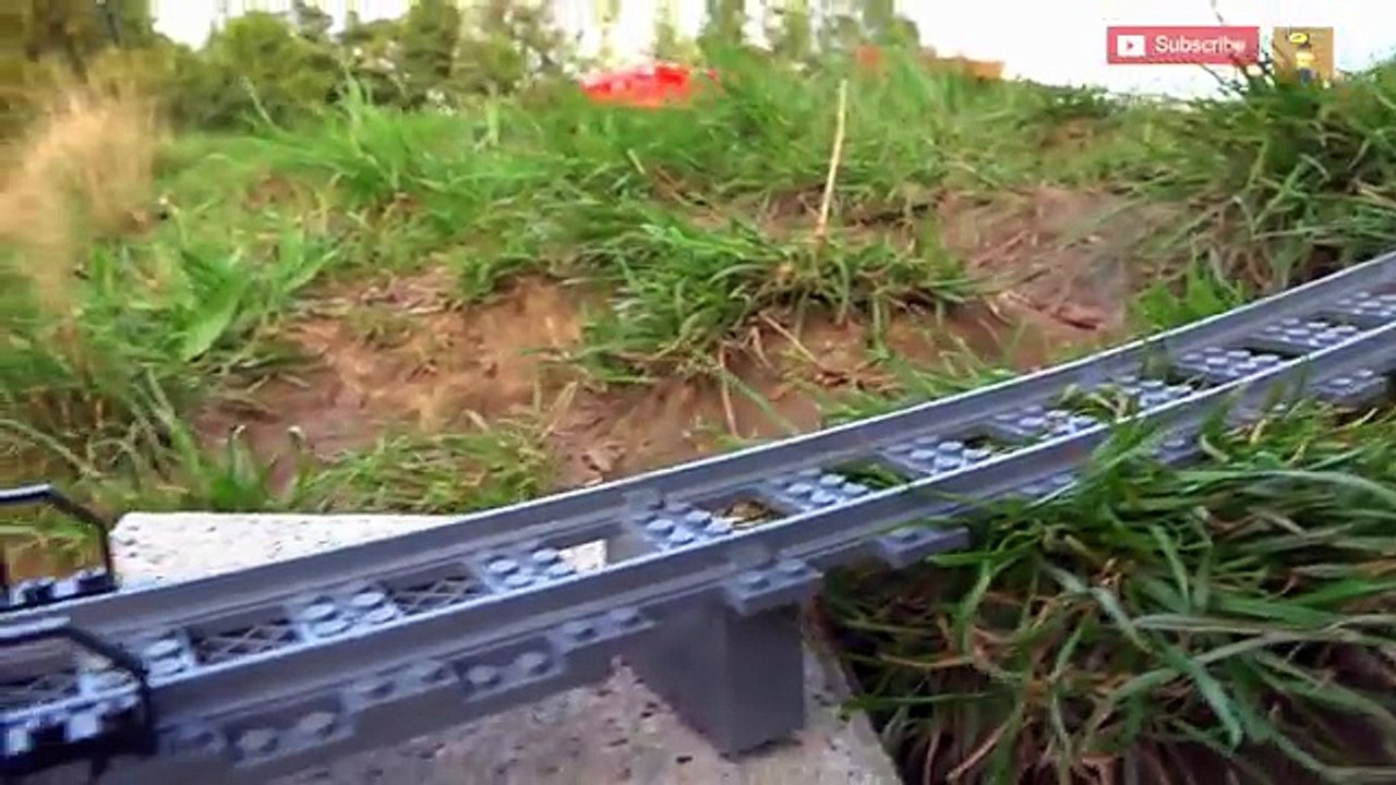 Lego train crash at a REAL waterfall .