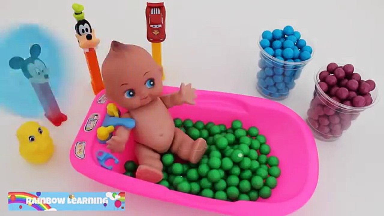 Learn Colors Baby Doll Bath Time Playing with Disney Candy Pez and Gumballs