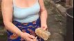 Oyinbo woman Grinds pepper with native grinding stone Calls out all nowadays ladies who use electric blinder