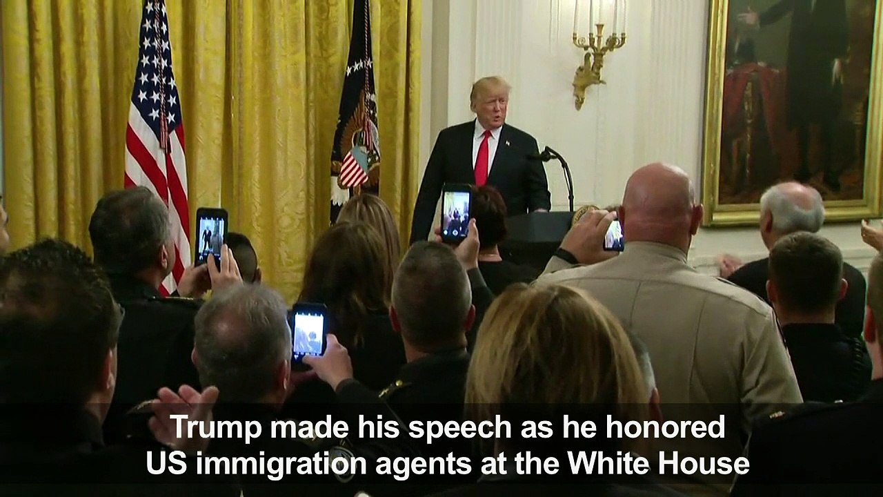 President Trump honours immigration agents at W...