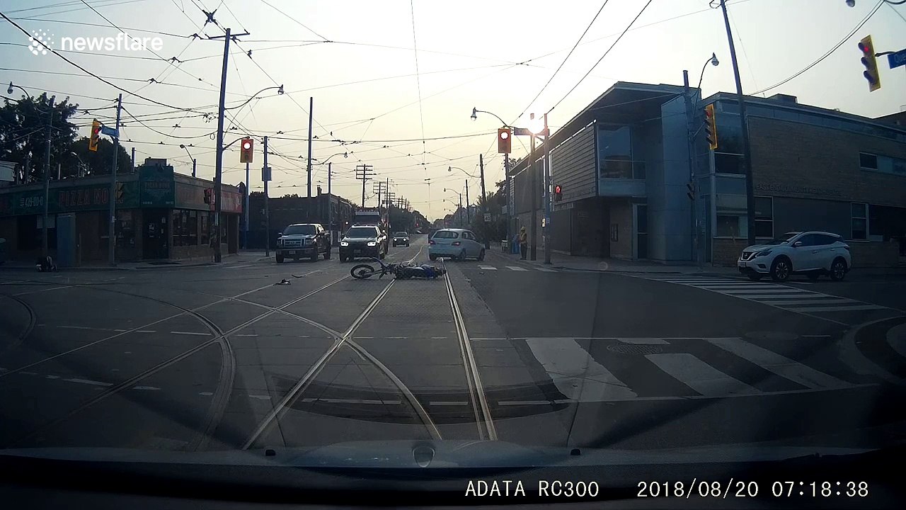 Motorcyclist tumbles into the air after head-on collision with car