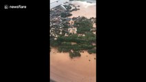 Aerial footage shows flooded homes in northern Thailand