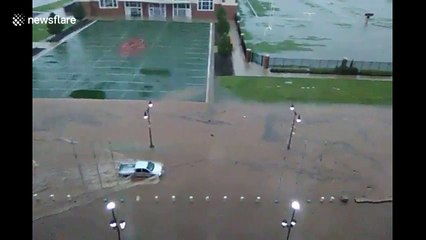 Pickup truck drives through deep floodwaters on OSU campus