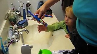 2 Year old kid brushing his teeth