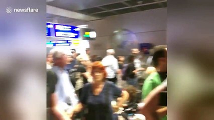 Passengers look uncertain as Frankfurt Airport terminal evacuated
