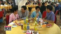 Separated families from the two Koreas share memories of the past during their group reunion