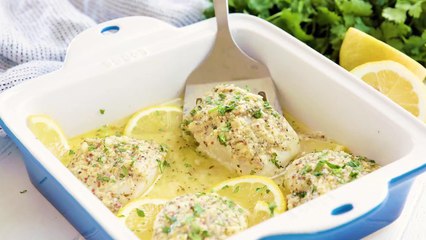 Easy Baked Cod Fish is smothered in a lemon garlic parmesan mixture that makes for a delicious piece of fish.WRITTEN RECIPE: