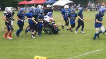 Opposing Football Teams Unite to Support Player in Wheelchair