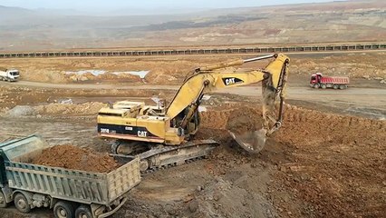 Caterpillar 385B LME Excavator Loading Mercedes Actros And Man Tgs