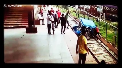 Scary moment battery car falls on tracks at Indian Railway station