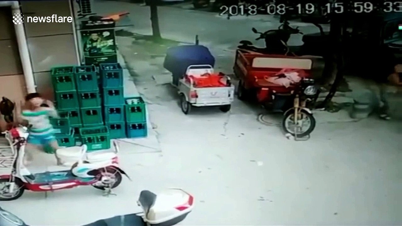 Close call: boy escapes being crushed by falling cladding