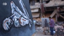 Artistas pintam em ruínas de antigo campo de refugiados na Síria