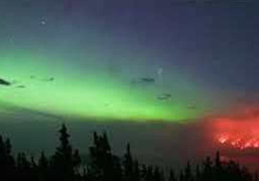 Timelapse Shows Northern Lights Swirl Next to Raging Wildfire in Canada