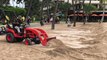 Worker uses bulldozer to build sand wall in Waikiki ahead of Hurricane Lane landfall
